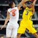 Michigan sophomore Trey Burke shoots around Florida junior Scottie Wilbekin during the second half at Cowboys Stadium on Sunday, March 31, 2013. Melanie Maxwell I AnnArbor.com
